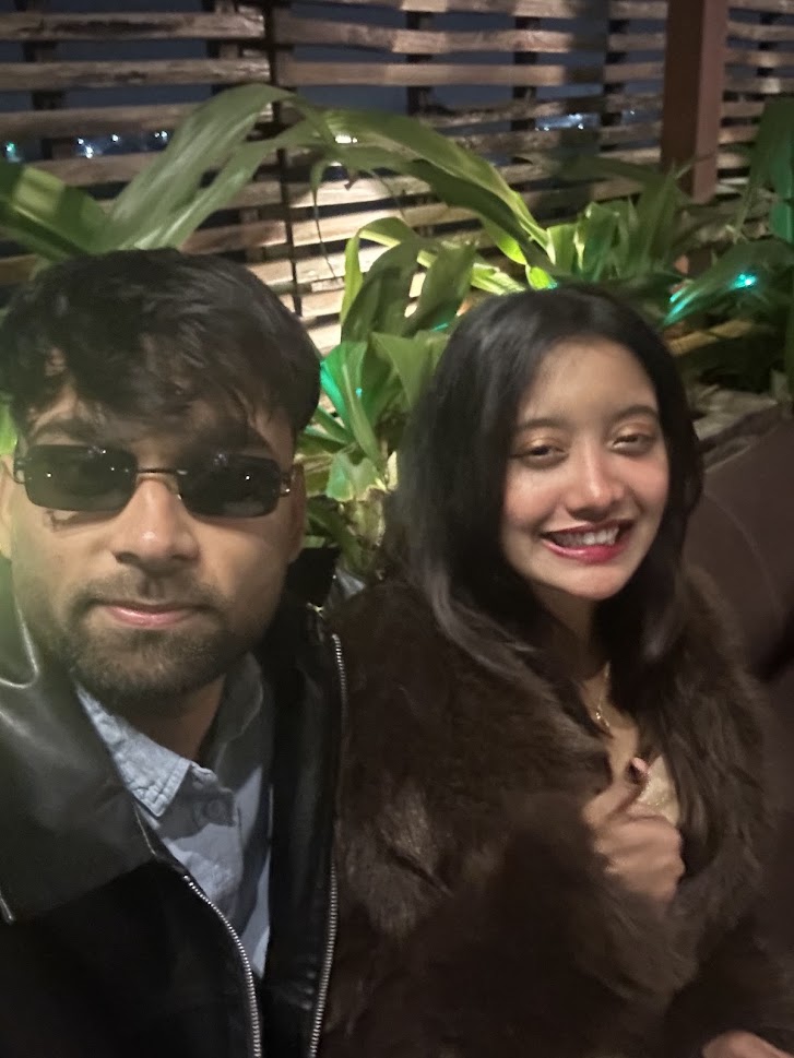Selfie together outdoors with greenery